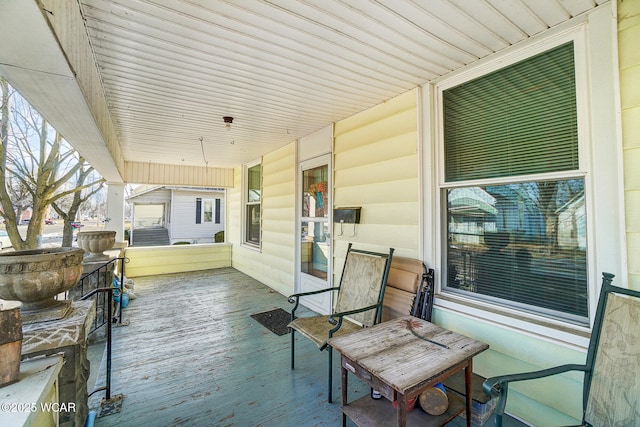 wooden terrace with covered porch