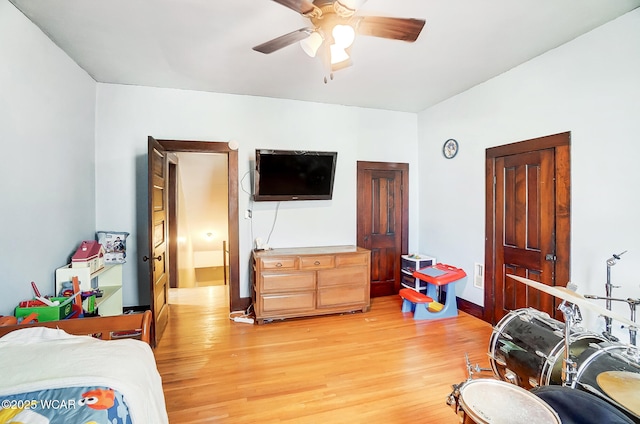 bedroom with hardwood / wood-style flooring and ceiling fan