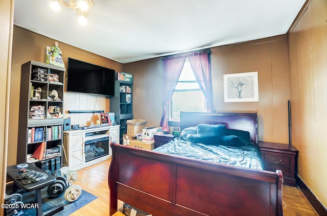 bedroom with light wood-type flooring