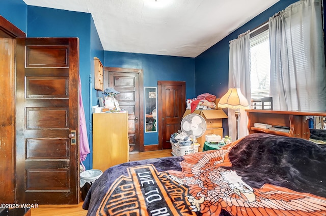 bedroom featuring hardwood / wood-style floors