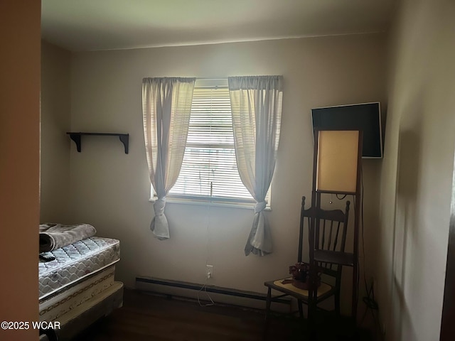 1121 Bahama Dr, Lima, OH 45801 - bedroom with a baseboard heating unit and wood finished floors