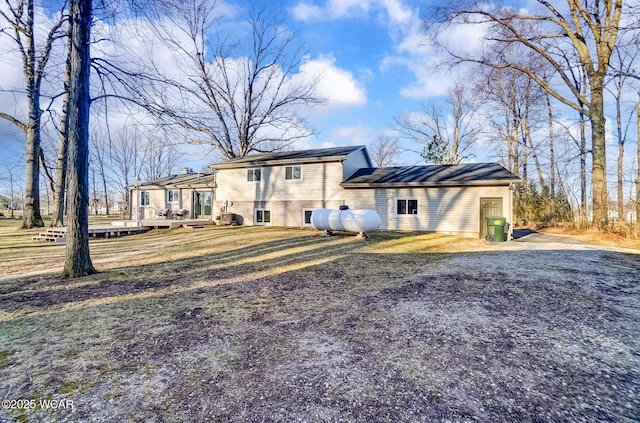 tri-level home featuring a deck