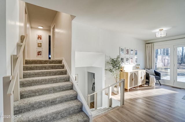 stairs with wood finished floors