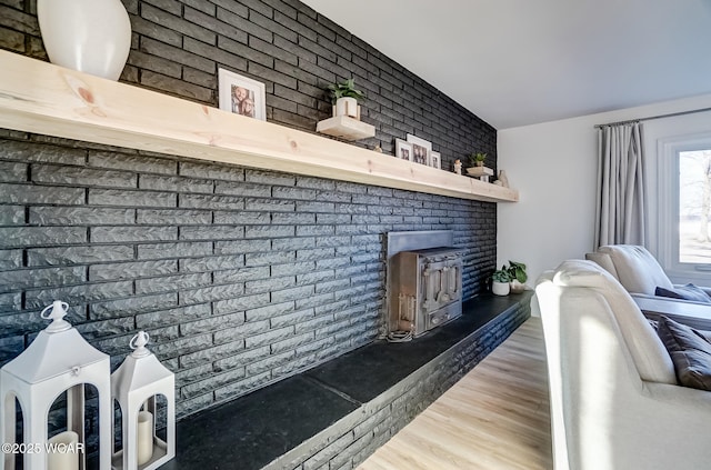 interior space with a fireplace and wood finished floors