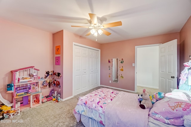 carpeted bedroom featuring a closet, ceiling fan, and baseboards