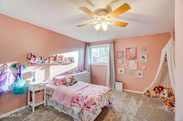 carpeted bedroom with baseboards and a ceiling fan