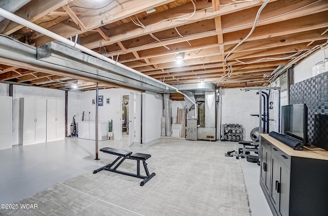 workout room featuring heating unit and water heater