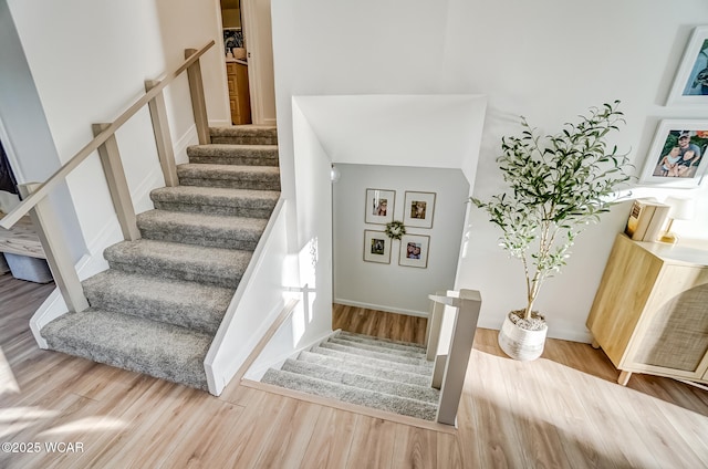 stairway with wood finished floors