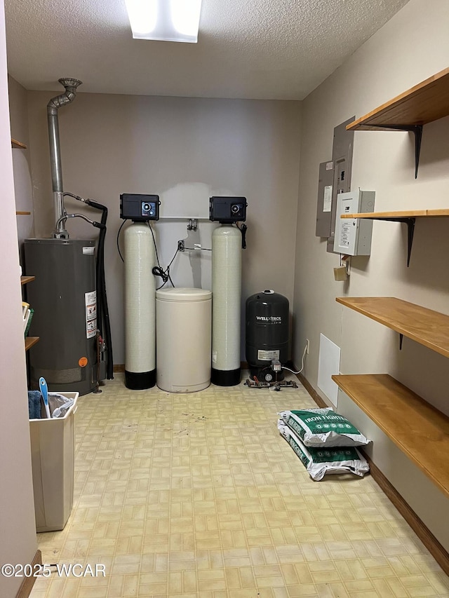 utility room featuring water heater