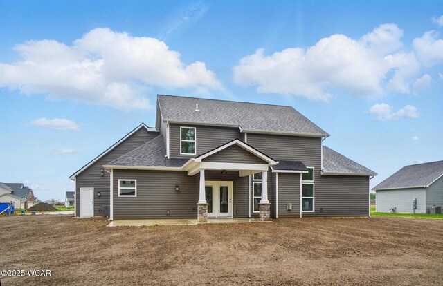 1291 Madison Blvd, Van Wert, OH 45891 - rear view of property featuring roof with shingles, a patio, and cooling unit