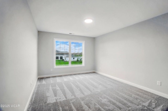 1291 Madison Blvd, Van Wert, OH 45891 - unfurnished room featuring baseboards, carpet, and visible vents
