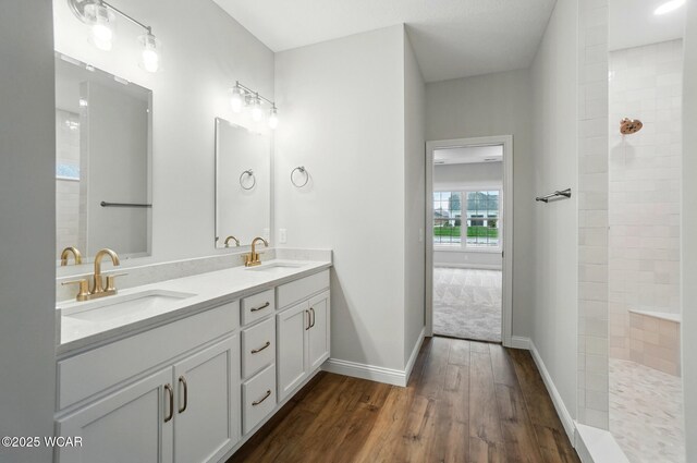 1291 Madison Blvd, Van Wert, OH 45891 - bathroom with a sink, a walk in shower, double vanity, and wood finished floors