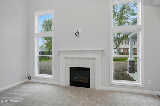 1291 Madison Blvd, Van Wert, OH 45891 - unfurnished living room with carpet floors, baseboards, and a fireplace