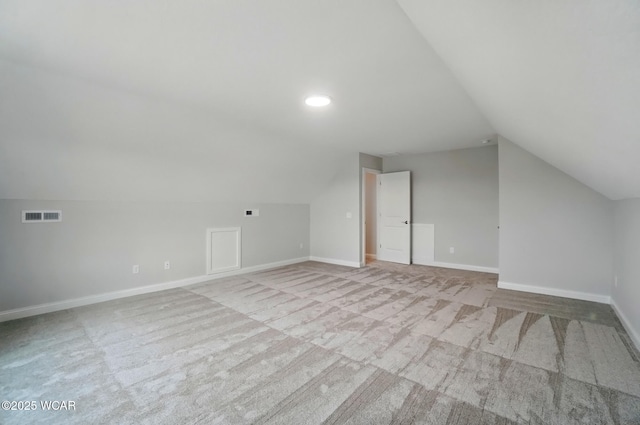 1291 Madison Blvd, Van Wert, OH 45891 - additional living space with carpet floors, baseboards, visible vents, and vaulted ceiling
