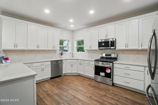 1291 Madison Blvd, Van Wert, OH 45891 - kitchen with a sink, white cabinetry, appliances with stainless steel finishes, and tasteful backsplash