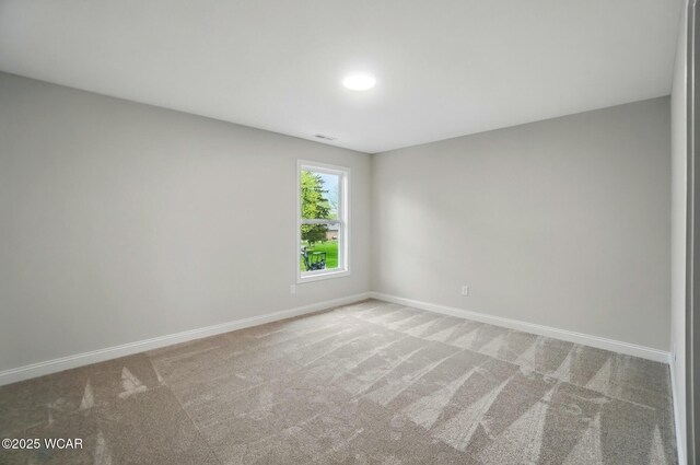 1291 Madison Blvd, Van Wert, OH 45891 - empty room featuring baseboards, visible vents, and carpet