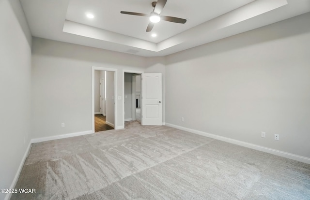 1291 Madison Blvd, Van Wert, OH 45891 - unfurnished bedroom featuring ceiling fan, a raised ceiling, carpet floors, recessed lighting, and baseboards