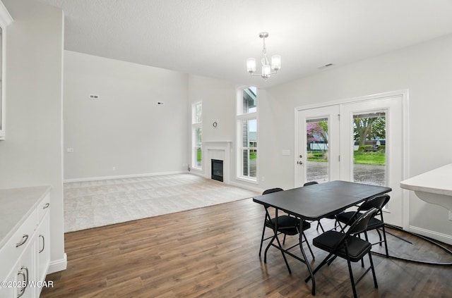 1291 Madison Blvd, Van Wert, OH 45891 - dining area with a wealth of natural light, dark wood finished floors, a chandelier, and visible vents