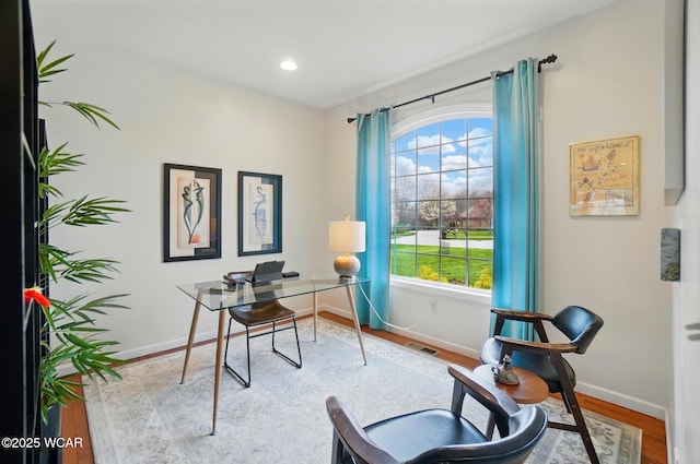 office with baseboards, recessed lighting, wood finished floors, and visible vents