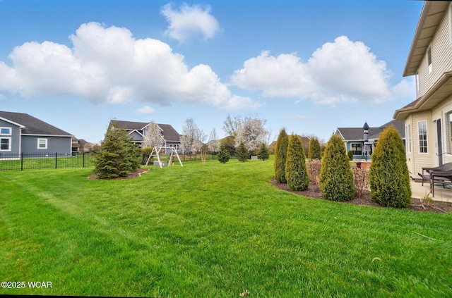 view of yard featuring fence and a patio