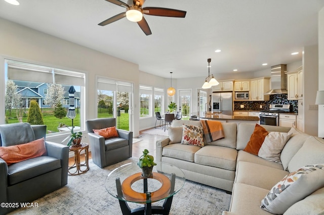 living room featuring recessed lighting and ceiling fan