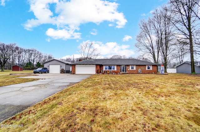 ranch-style house with aphalt driveway, a front yard, and brick siding