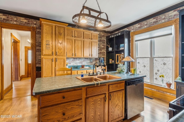 827 N Main St, Fostoria, OH 44830 - kitchen featuring stainless steel dishwasher, a sink, crown molding, dark countertops, and light wood-style floors