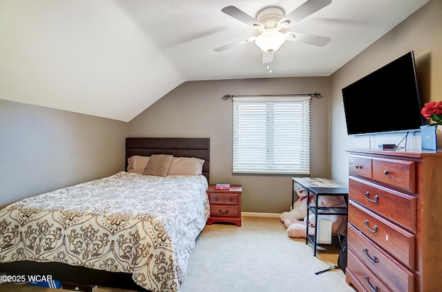 bedroom featuring ceiling fan, lofted ceiling, and light colored carpet