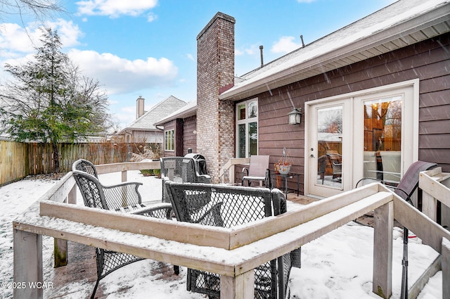 view of snow covered deck