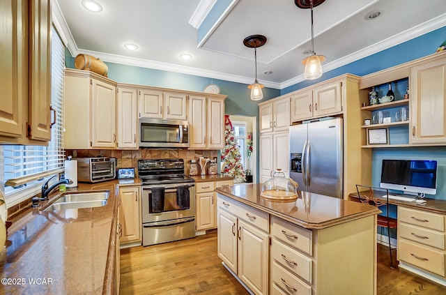 kitchen with sink, a center island, pendant lighting, stainless steel appliances, and backsplash