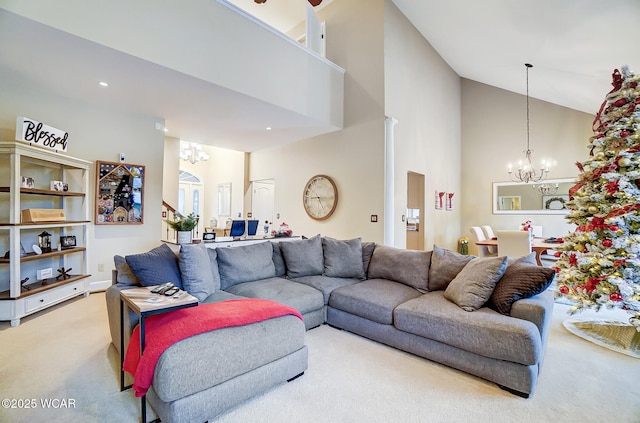 living room featuring a notable chandelier, a towering ceiling, and carpet floors