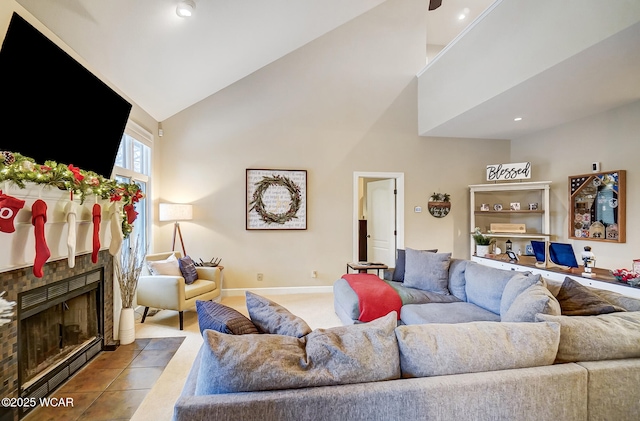 tiled living room featuring a fireplace and high vaulted ceiling