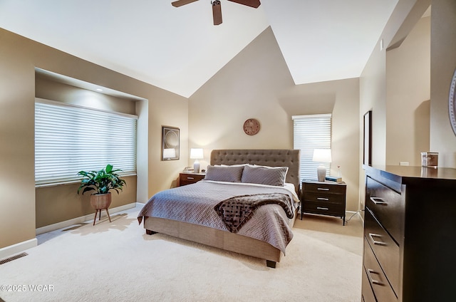 carpeted bedroom featuring multiple windows, lofted ceiling, and ceiling fan