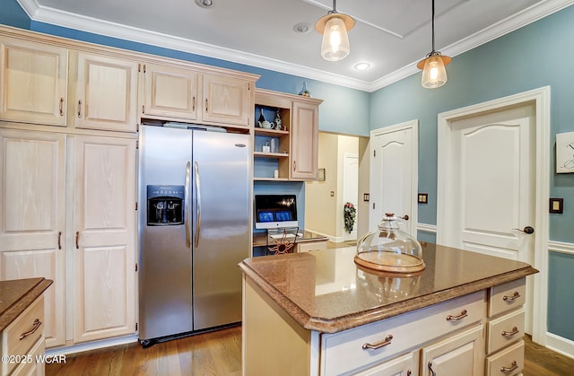 kitchen featuring decorative light fixtures, dark stone counters, a center island, light hardwood / wood-style floors, and stainless steel fridge with ice dispenser