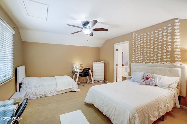 bedroom with lofted ceiling, light carpet, and ceiling fan