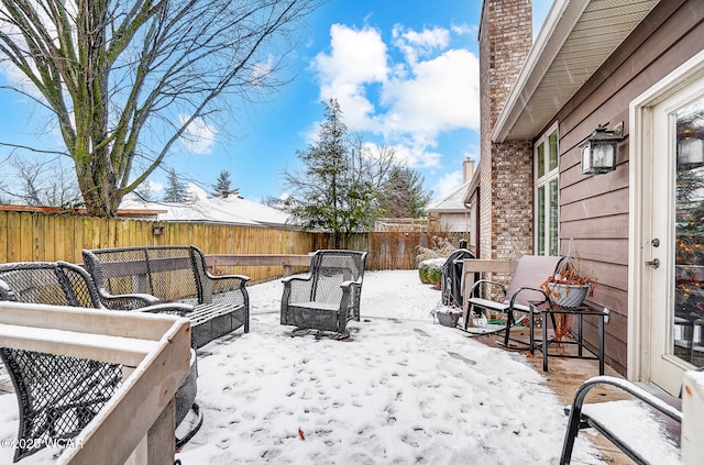 snow covered deck featuring an outdoor hangout area