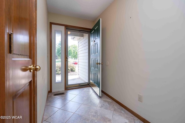 81 Riley Creek Ct, Bluffton, OH 45817 - doorway to outside with baseboards and light tile patterned floors
