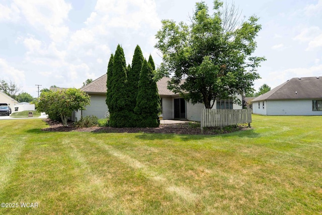81 Riley Creek Ct, Bluffton, OH 45817 - rear view of house with a lawn and a shingled roof