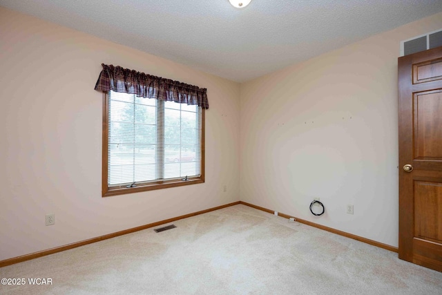 81 Riley Creek Ct, Bluffton, OH 45817 - carpeted empty room with baseboards and a textured ceiling