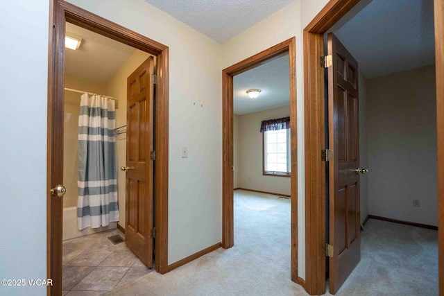 81 Riley Creek Ct, Bluffton, OH 45817 - corridor with a textured ceiling and light carpet
