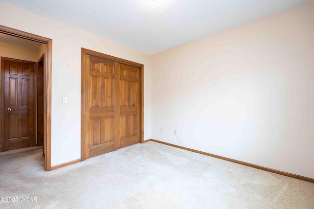 81 Riley Creek Ct, Bluffton, OH 45817 - unfurnished bedroom with carpet flooring, a closet, and a textured ceiling