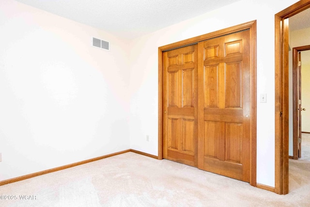 81 Riley Creek Ct, Bluffton, OH 45817 - unfurnished bedroom with light colored carpet and a closet