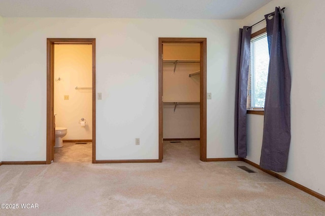 81 Riley Creek Ct, Bluffton, OH 45817 - unfurnished bedroom with carpet flooring, a walk in closet, a closet, and connected bathroom