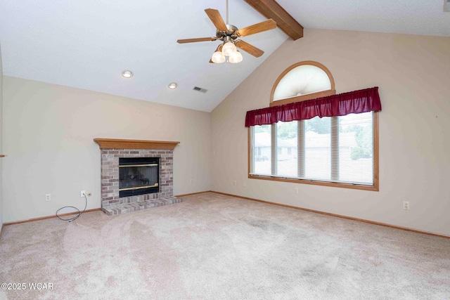 81 Riley Creek Ct, Bluffton, OH 45817 - unfurnished living room with beamed ceiling, carpet flooring, ceiling fan, a brick fireplace, and high vaulted ceiling
