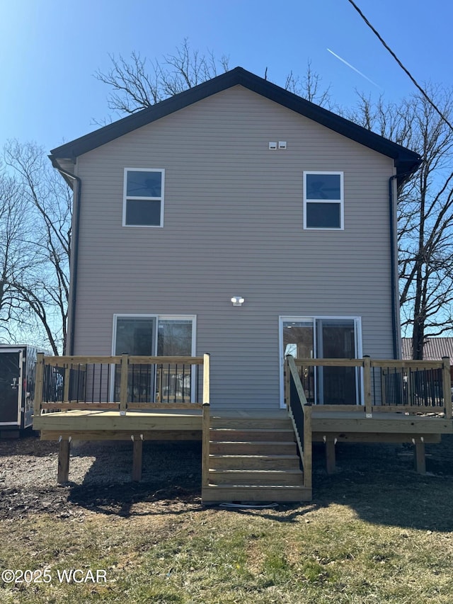 rear view of property with a wooden deck