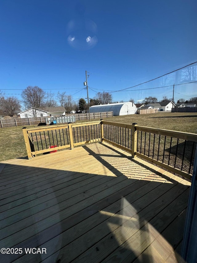 wooden terrace featuring a yard and a fenced backyard