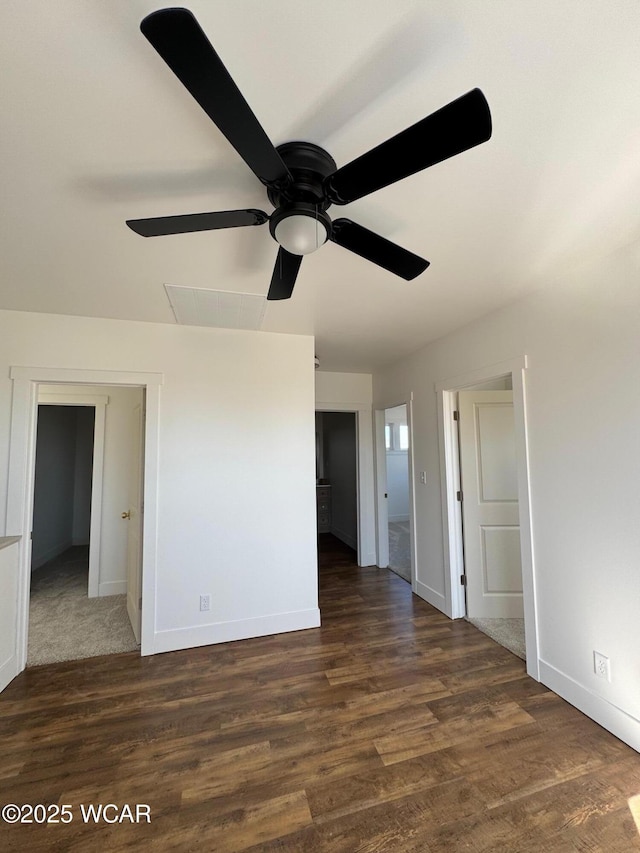 spare room featuring ceiling fan, baseboards, and wood finished floors