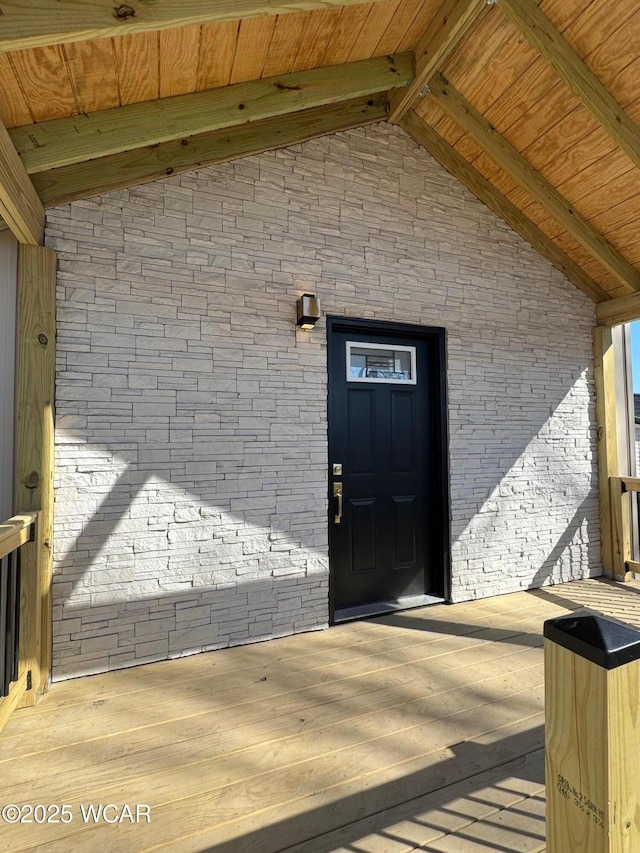 doorway to property with brick siding