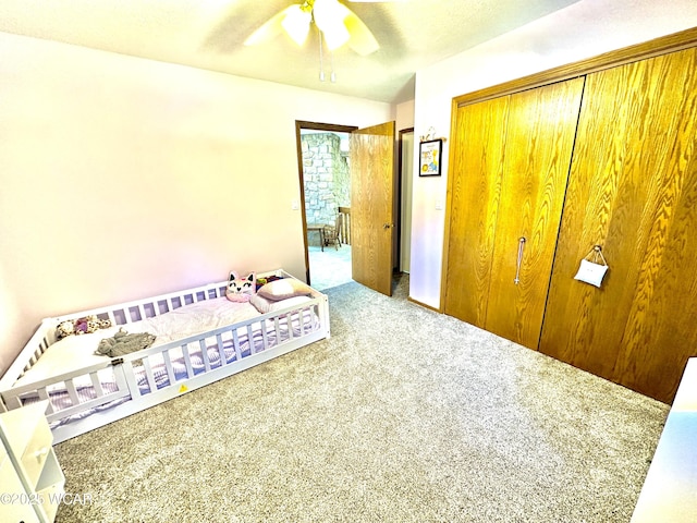 2969 Sands Rd, Lima, OH 45805 - carpeted bedroom with a closet and a ceiling fan