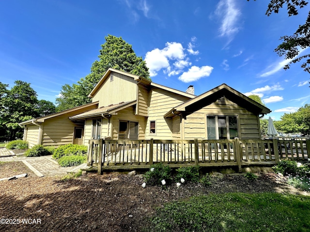 2969 Sands Rd, Lima, OH 45805 - rear view of house featuring a chimney and a deck